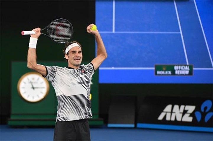 Roger Federer celebrates his Australian Open win against Rafael Nadal in Melbourne on Sunday