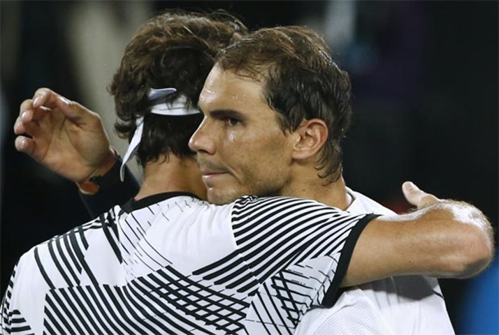 Roger Federer embraces Rafael Nadal after winning the championship