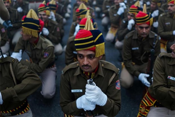 Delhi police personnel prepare to march as they rehearse for the parade at Rajpath in New Delhi