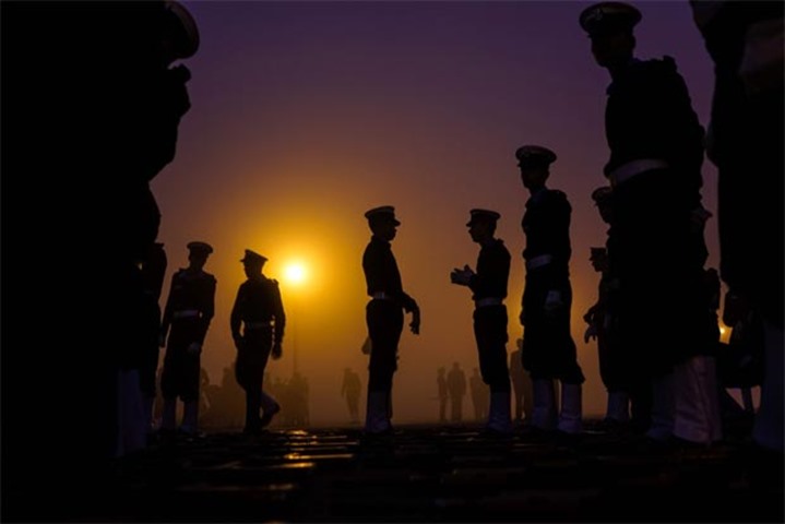 Military personnel get ready to march as they rehearse for the Republic Day parade in New Delhi
