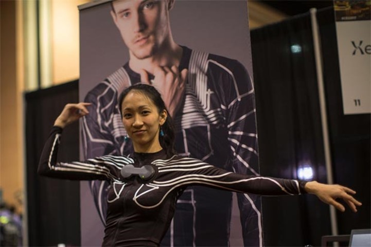 The body movements of Yuka Tomitori are measured by the Xenoma E-Skin suit she is wearing