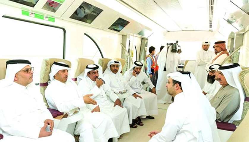 HE the Prime Minister is joined by ministers and dignitaries during a test ride on one of the trains