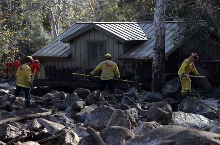 Firefighters search for people trapped in mudslide debris in Montecito, California