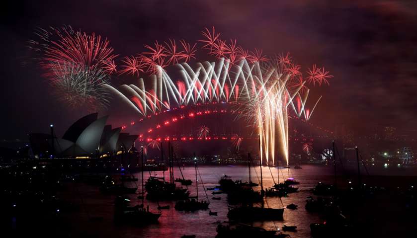 Fireworks light the sky over the Opera House and Harbour Bridge during New Year\'s Eve celebrations i