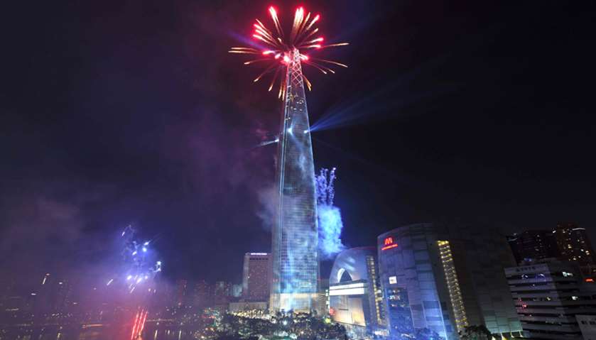 Fireworks light the sky over the Lotte World Tower, a 123-floor and 1821-foot (555 m) building in Se