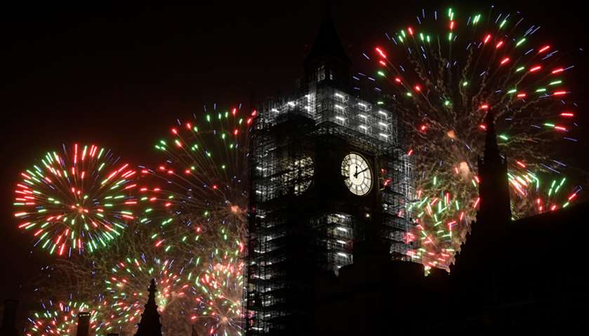 Fireworks explode behind the Elizabeth Tower, commonly known as Big Ben, during New Year\'s Eve celeb