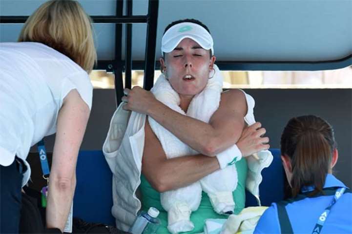 France\'s Alize Cornet reacts while receiving treatment on the bench at the Australian Open