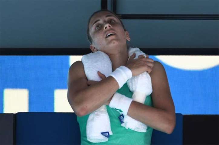 Croatia\'s Petra Martic uses an ice towel during her third round match in Melbourne on Friday