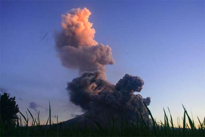 A column of ash shoots up from the Mayon volcano in Albay province on Wednesday