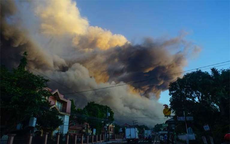 Ash rises up from the Mayon volcano as it continues to erupt