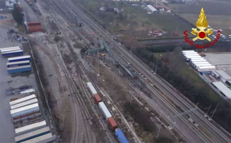 A handout picture released by the Italian Vigili del Fuoco shows an aerial view of a derailment