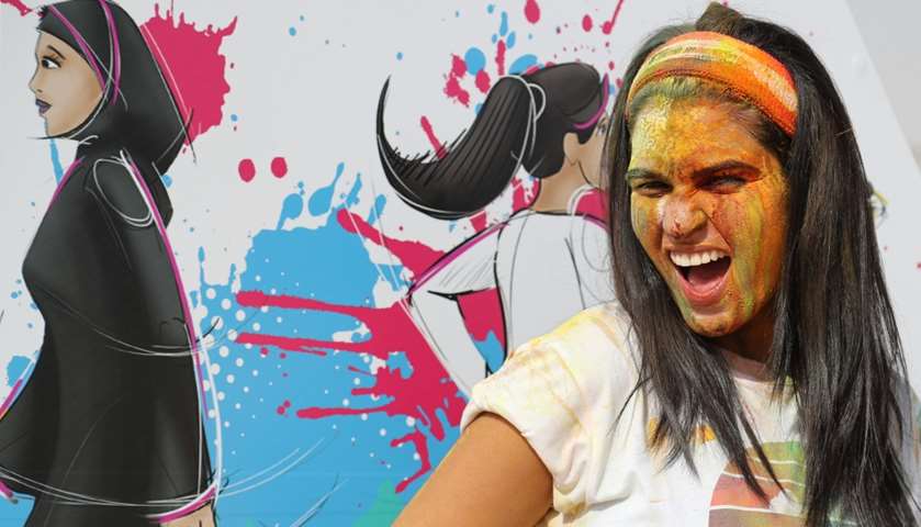 A girl covered with coloured powder