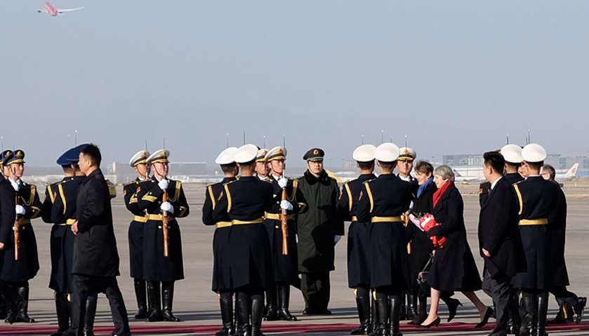 British Prime Minister Theresa May arrives at the Wuhan airport in Hubei province, China