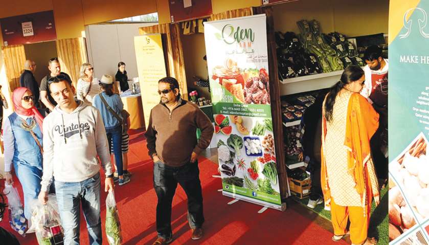 Families throng Katara\'s southern area to buy fresh vegetables, poultry and other locally-produced p