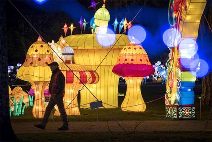 Visitors look at giant lanterns installed in the Foucaud Park in Gaillac, southwestern France