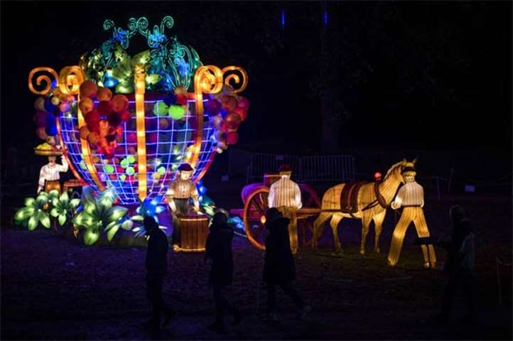 Visitors look at a lantern scene in the Foucaud Park in Gaillac, southwestern France