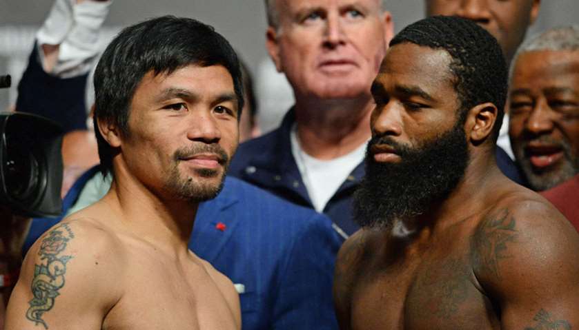 Manny Pacquiao (left) and Adrien Broner (right) face off during a welterweight world title boxing ma