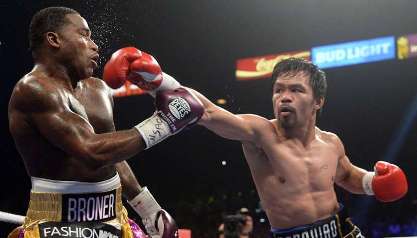 Manny Pacquiao (black trunks) and Adrien Broner (purple/gold trunks) box during a WBA welterweight w