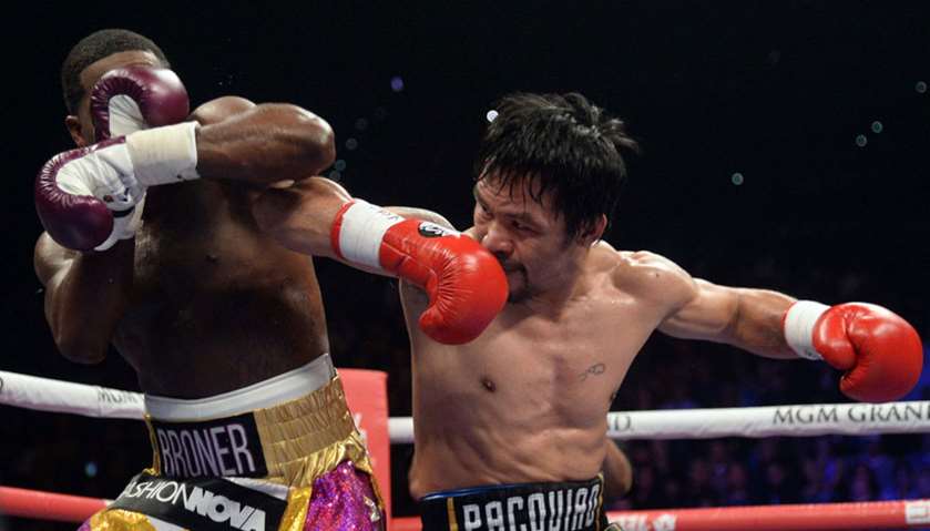 Manny Pacquiao (black trunks) and Adrien Broner box during a WBA welterweight world title boxing mat