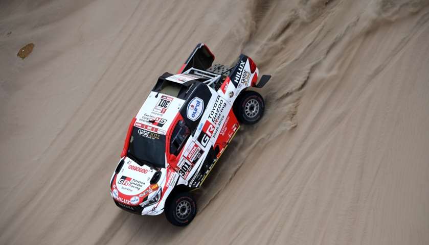 Toyota\'s driver Nasser Al-Attiyah of Qatar (R) and his co-driver Mathieu Baumel of France compete