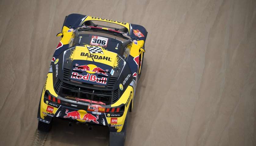 Peugeot\'s French driver Sebastien Loeb and co-driver Daniel Elena of Monaco compete