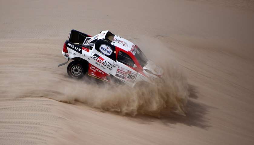 Toyota\'s driver Giniel De Villiers of South Africa and his co-driver Dirk Von Zitzewitz of Germany c