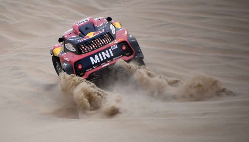 Mini\'s driver Stephane Peterhansel and his co-driver David Castera of France compete