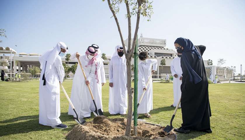 QM chairperson HE Sheikha al-Mayassa and officials planting a tree during the visit to the Post Offi