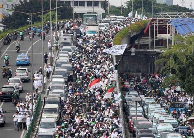 Indonesian protesters take part in a rally against Governor Basuki Tjahaja Purnama