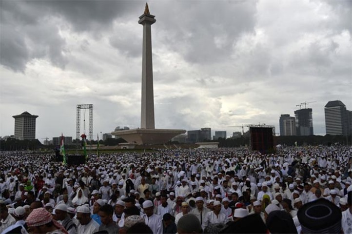 Indonesian Muslims gather as part of a rally against Jakarta governor on Friday