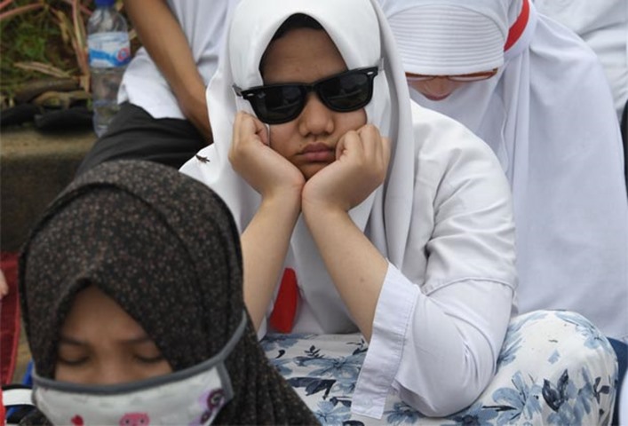 A protester attends a rally against Jakarta\'s Christian Governor Basuki Tjahaja Purnama on Friday