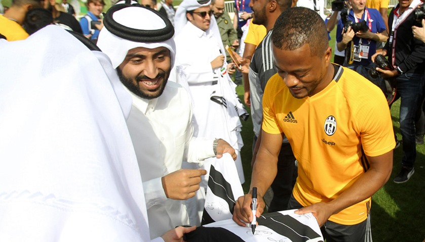 Juventus\' Patrice Evra signs autographs
