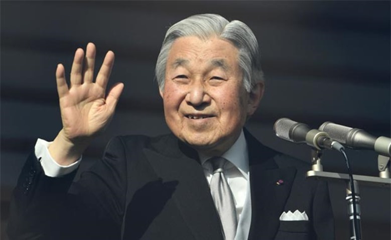 Emperor Akihito waves to well-wishers as he celebrates his 83rd birthday in Tokyo on Friday