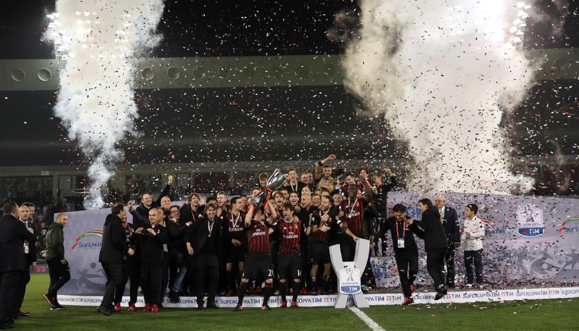 AC Milan\'s players celebrate winning against Juventus during the Italian Super Cup final match