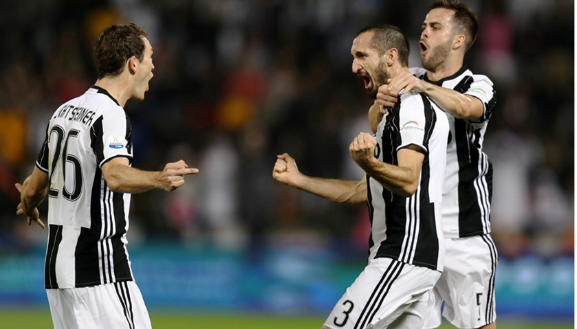Juventus\' Giorgio Chiellini celebrates after scoring against AC Milan.