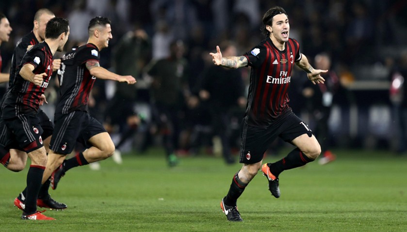 AC Milan\'s team celebrates after beating Juventus.