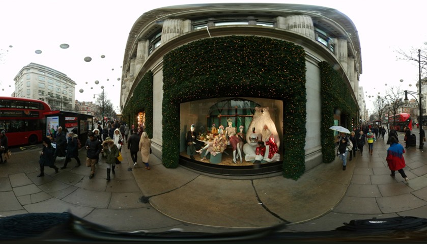 The holiday windows of Selfridges department store line Oxford Street in London, England