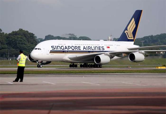 A Singapore Airlines\' A380 arrives at Changi Airport in Singapore on Thursday