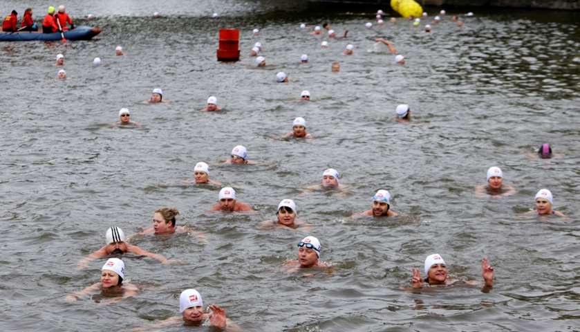 Swimmers participate in winter swimming competition in Vltava river, Prague, Czech Republic