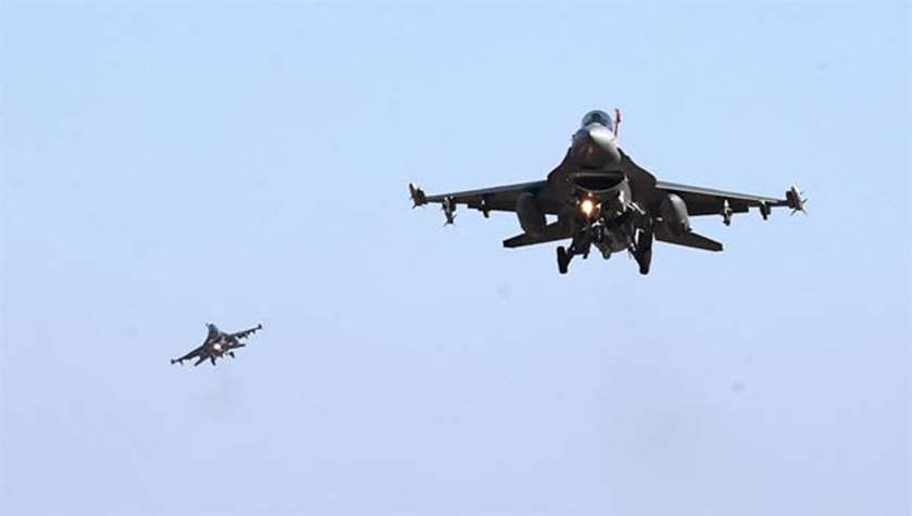 US Air Force F-16 fighter jets fly over the Osan Air Base in Pyeongtaek