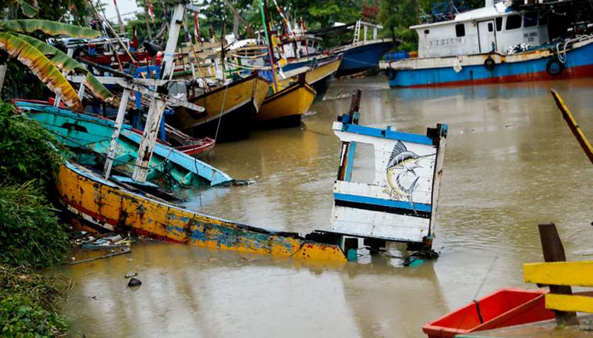 A destroyed boat is seen after a tsunami hit an area near Carita in Pandeglang, Banten province