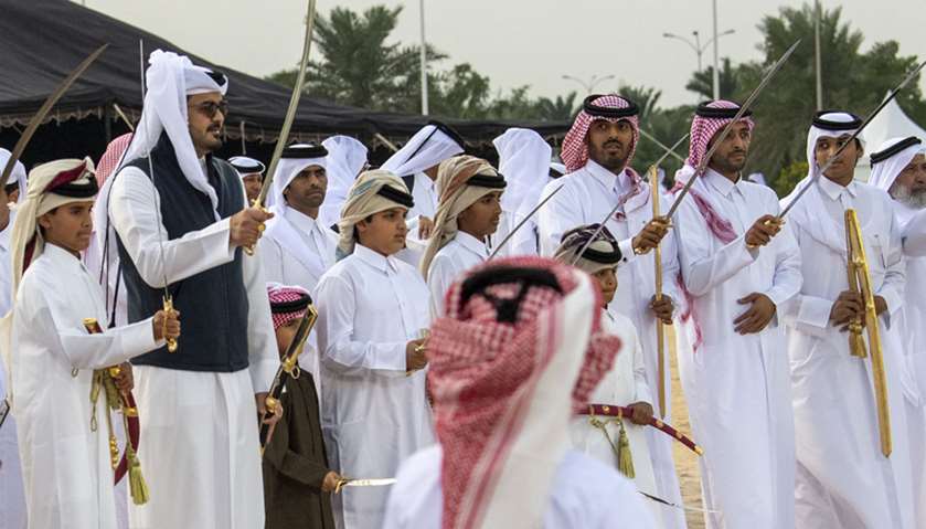 Amir participates in Arda (Qatar’s traditional sword dance) held in Amiri Diwan Yard