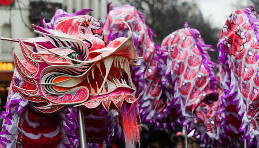 Revelers perform a dragon dance during the Chinese lunar new year celebrations, in Paris