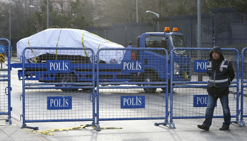 Car which was damaged in the explosion is removed from the site in Ankara
