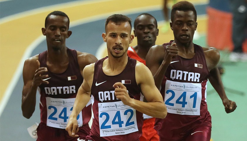 Qatar\'s Mohamad Algarni (C) reacts after winning the 1500m event