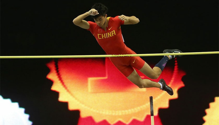 Bokai Huang of China clears the bar in the men\'s pole vault athletics event