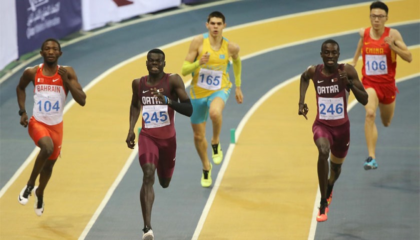 Qatar\'s Abdalelah Hassan (2-R) competes in the 400m men\'s event
