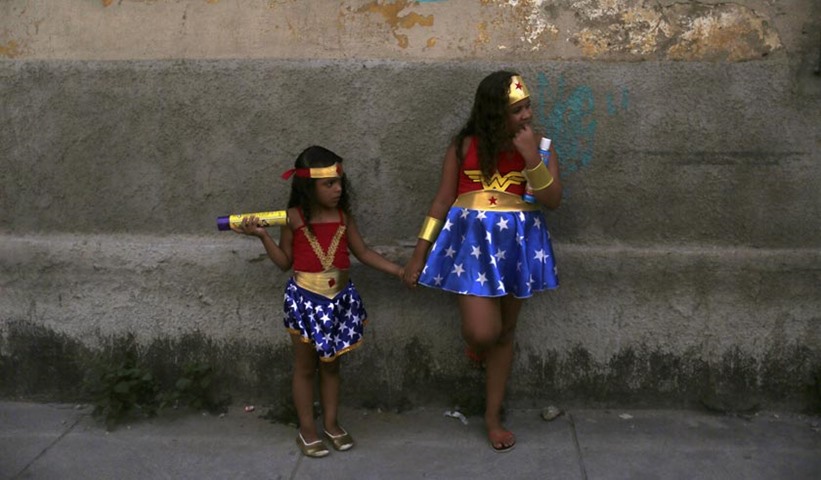 Girls dressed as Wonder Woman attend one of the carnival parties in Rio de Janeiro.