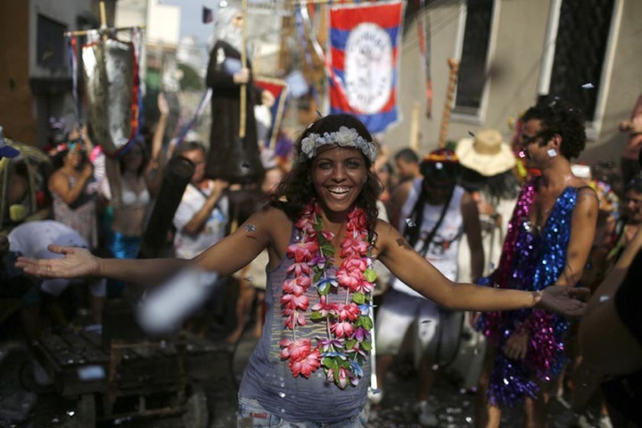 A reveller takes part in an annual block party known as \"Cordao de Prata Preta\" in Rio de Janeiro.