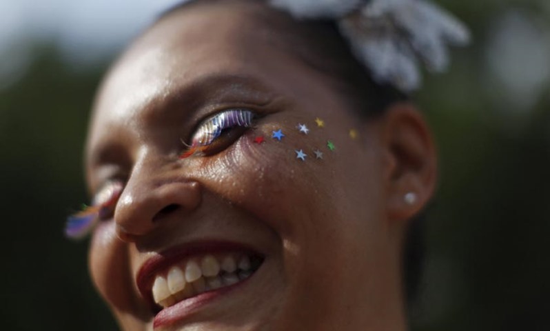 A reveller enjoys the fun at one of the carnival parties in the neighbourhoods of Rio de Janeiro.